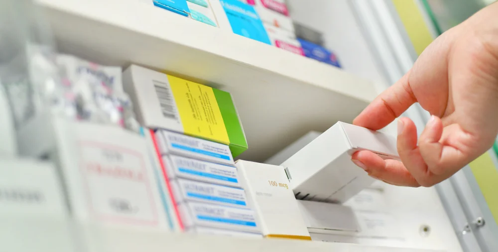 a hand holding a white box / A Complete Guide to the Medication Therapy Management Program / What Is a Medication Therapy Management Program? / Key Components of a Medication Therapy Management Program / Who Can Benefit From MTM Programs? / Benefits of Medication Therapy Management / How to Enroll in a Medication Therapy Management Program / Local Pharmacies Offering MTM Services / Role of Pharmacists in MTM / Medication Therapy Management vs. Regular Pharmacy Services / Monitoring and Personalized Care / Why Medication Therapy Management Matters / Pharmacy CareRX
