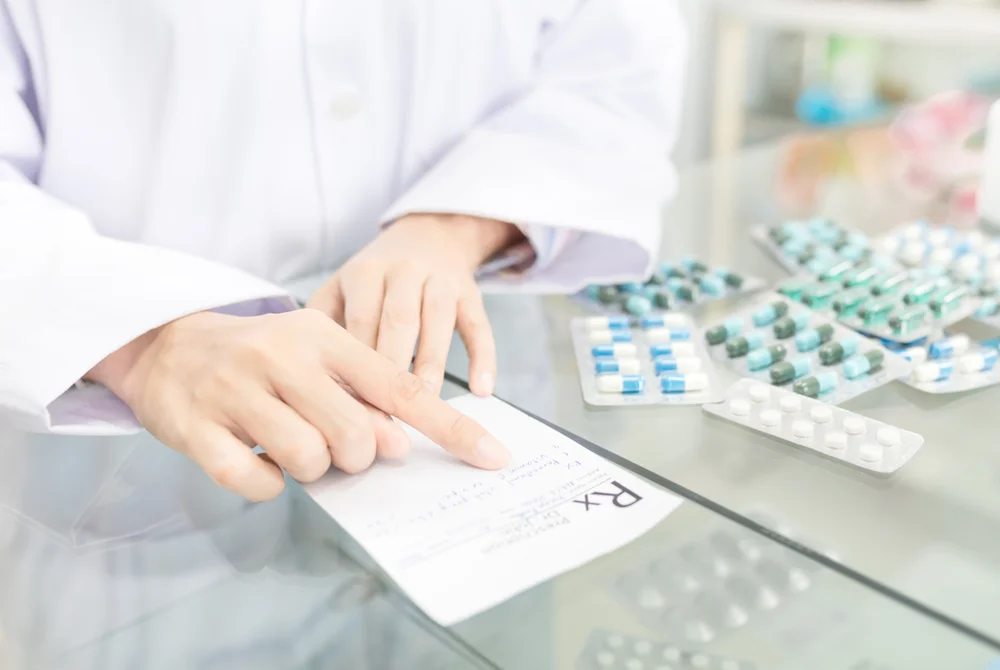 a person pointing at a prescription / What to Do When Medication Goes Wrong: A Simple Guide for Families, Carers, and Managers / Common Medication Errors / What to Do When Medication Goes Wrong / What Managers Should Do When Medication Errors Occur / How to Prevent Medication Errors in the Future / Handling Medication Mistakes with Confidence / Pharmacy CareRX in Florida