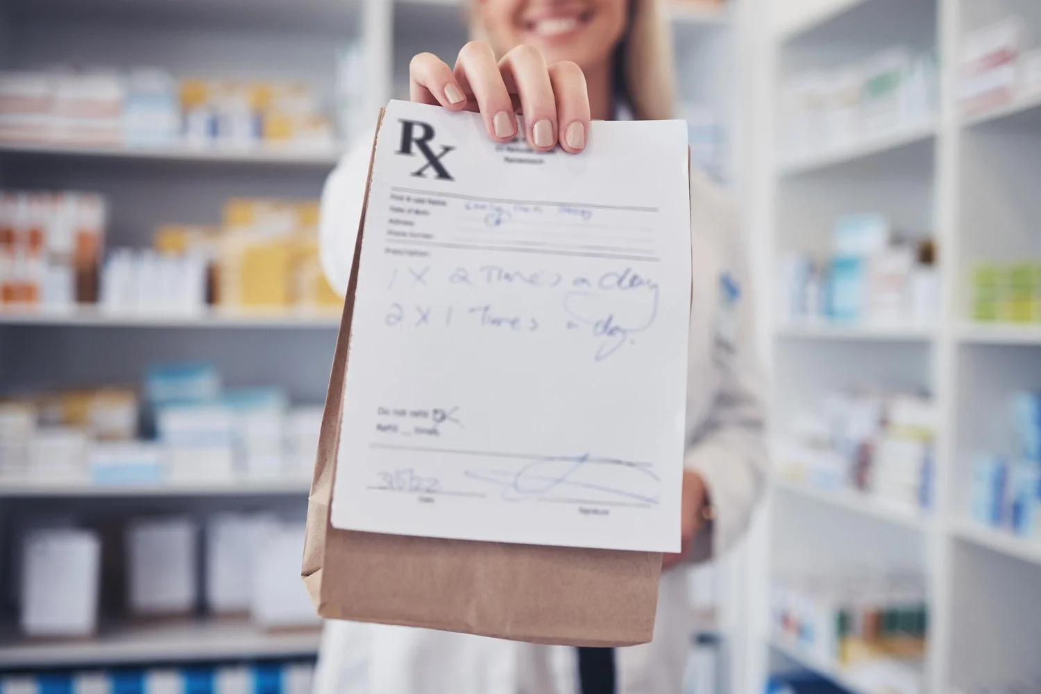 a woman holding a prescription / Understanding Brown Bagging in Pharmacy: What You Need to Know / What Is Brown Bagging in Healthcare? / When and Where Is Brown Bagging Used? / How the Brown Bagging Process Works / Why Healthcare Systems Use Brown Bagging / Risks and Concerns of Brown Bagging / Brown Bagging vs. White Bagging: What’s the Difference? / What Is Clear Bagging and How Is It Different? /Safety Guidelines for Brown Bagging / Perspectives from Payers and Providers / Pros and Cons of Brown Bagging / Benefits of Brown Bagging /Conclusion: Is Brown Bagging the Right Choice? / Pharmacy Care Rx
