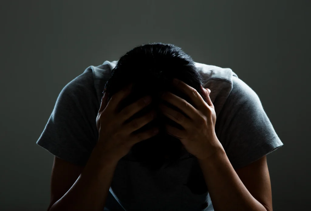 A Man experiencing anxiety due to Side Effects of Missing a Dose of Lamotrigine