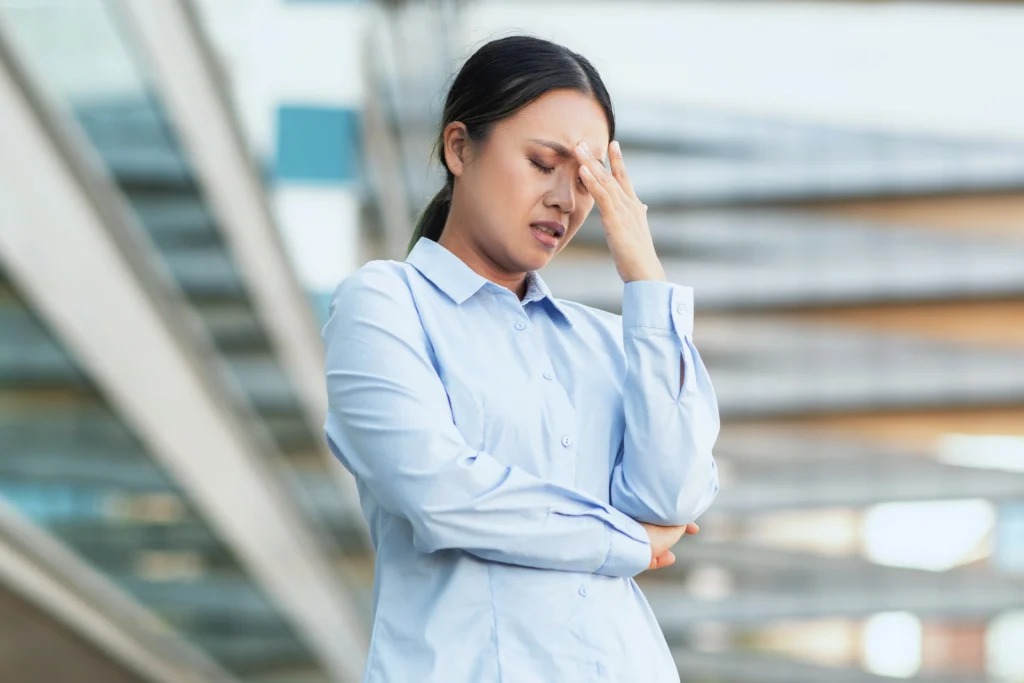 A Woman experiencing dizziness due to Side Effects of Missing a Dose of Lexapro