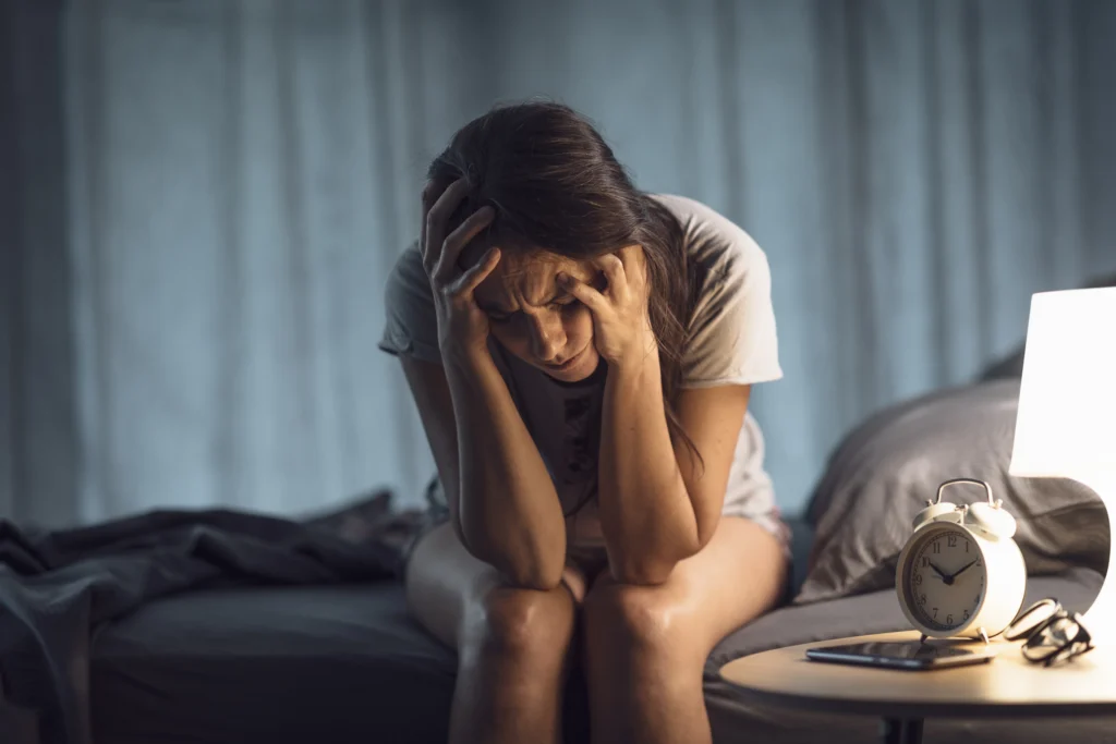 A woman experiencing headache due to Side Effects of Missing a Dose of Wellbutrin.
