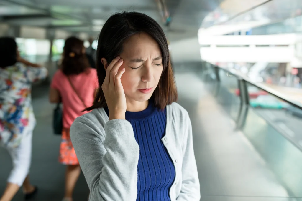 A woman experiencing headache due to Side Effects of Missing a Dose of Cymbalta
