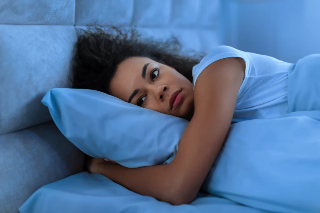 A woman experiencing trouble sleeping due to Side Effects of Missing a Dose of Gabapentin.