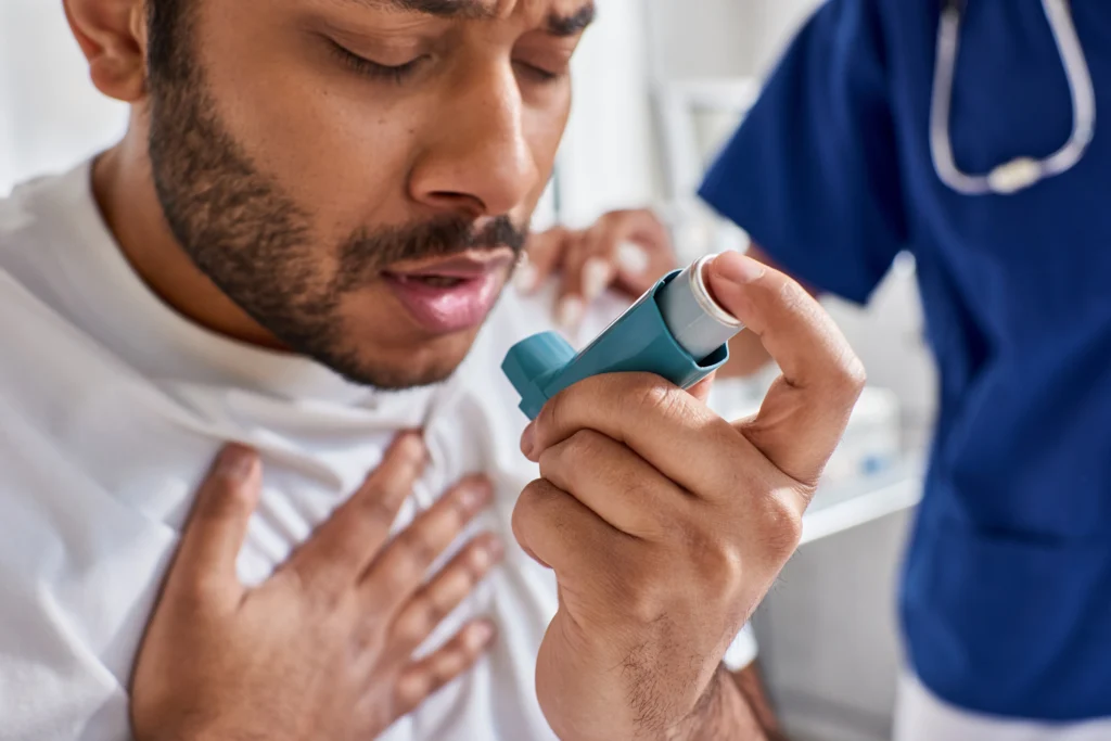 A man experiencing shortness of breath due to Side Effects of Missing a Dose of Albuterol
