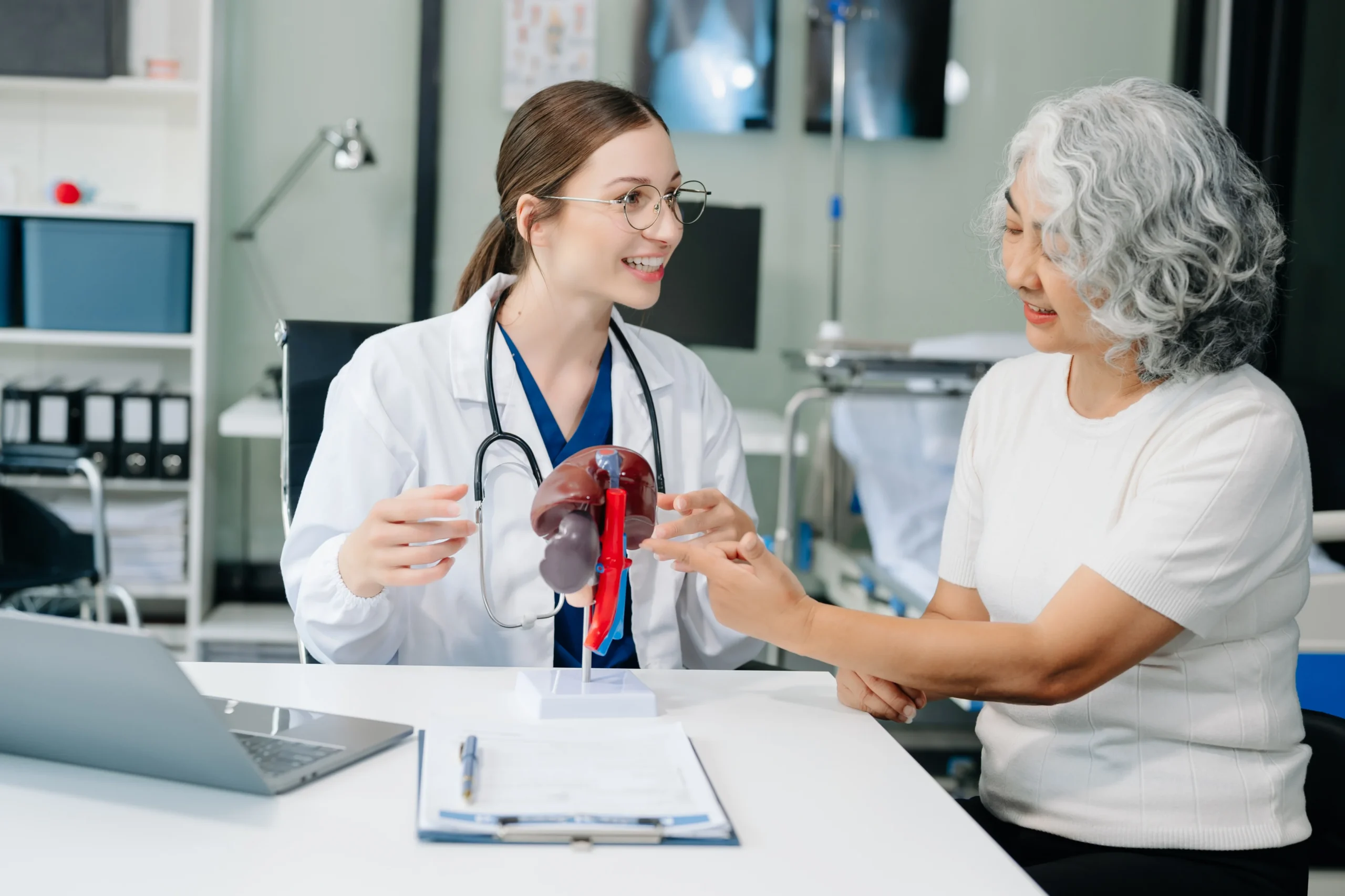 A doctor explaining to patient Why Taking Eliquis Consistently is important.
