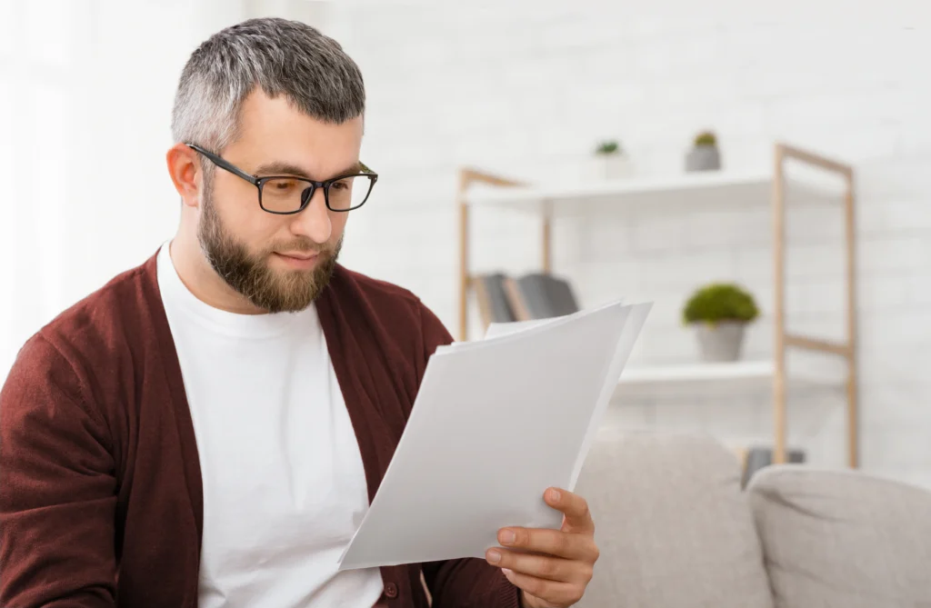 Man reviewing INR test results while taking warfarin medication