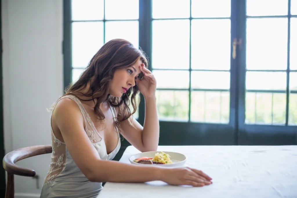 Woman experiencing loss of appetite while taking metformin