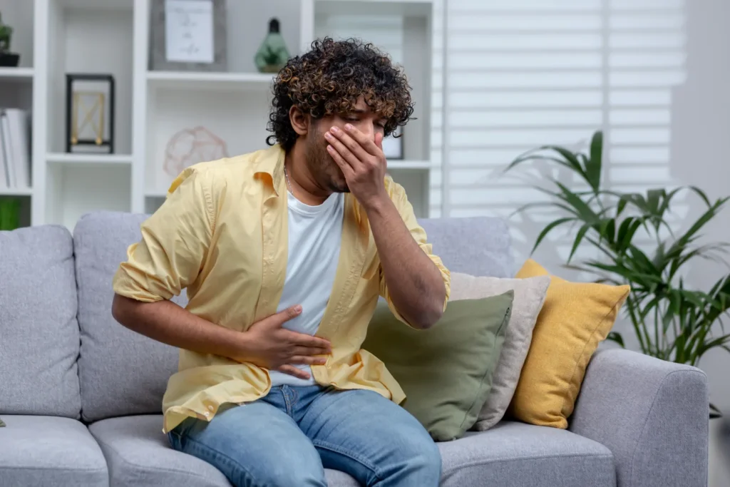 Person experiencing nausea and stomach discomfort while taking methylprednisolone