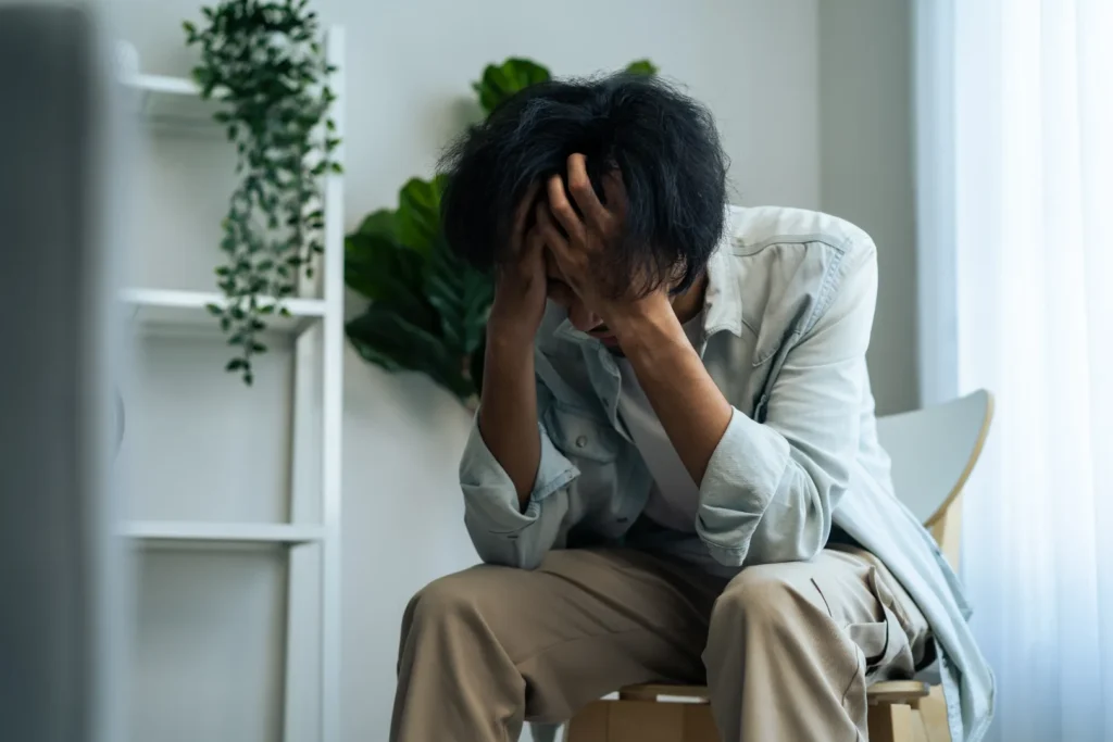 A Person experiencing anxiety due to Side Effects of Missing a Dose of Wellbutrin XL