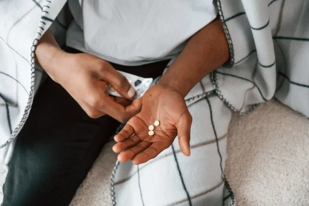A person taking Multiple medicines together.