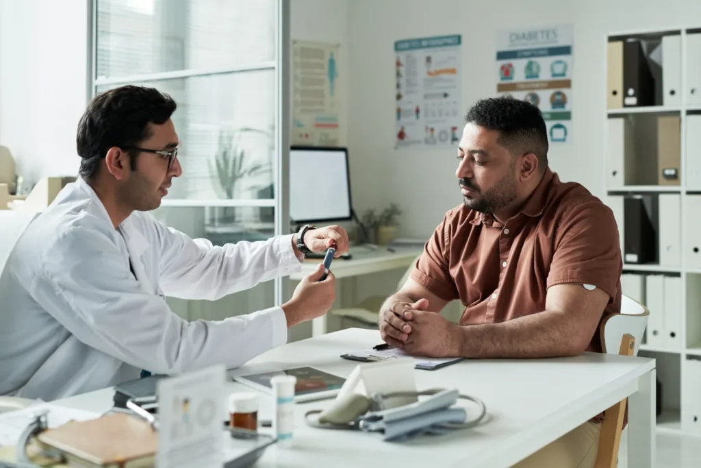 Doctor discussing medication and blood clot risks with a patient after a missed dose of Xarelto.